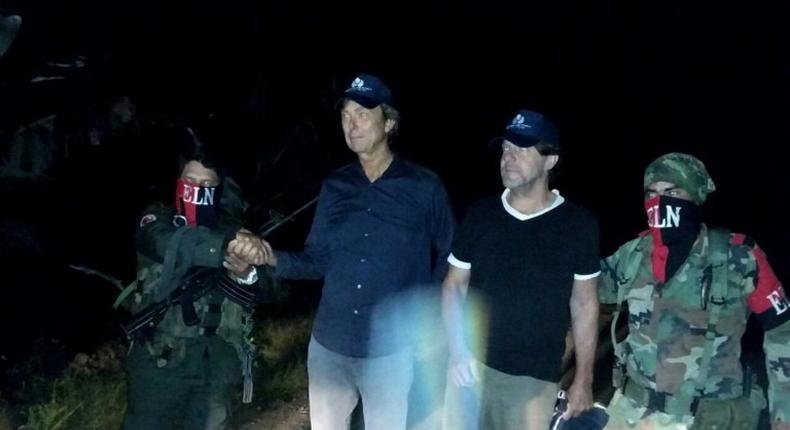 Dutch reporters Derk Johannes Bolt (2L) and Eugenio Ernest Marie Follender (2R) after their release by ELN rebels, upon arriving in Catatumbo, northeast Colombia on June 24, 2017, in an image released by the Colombian Ombudsman press office