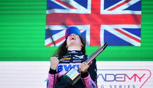 Abbi Pulling of Rodin Motorsport on the podium after winning an F1 Academy race.James Sutton - Formula 1/Getty Images