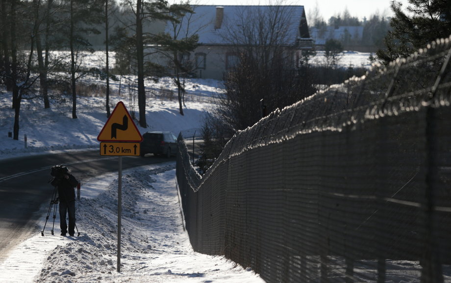 A cameraman films a military area in Stare Kiejkuty village, close to Szczytno in northeastern Poland January 24, 2014. Polish prosecutors were investigating allegations that the CIA ran a secret jail in a Polish forest.