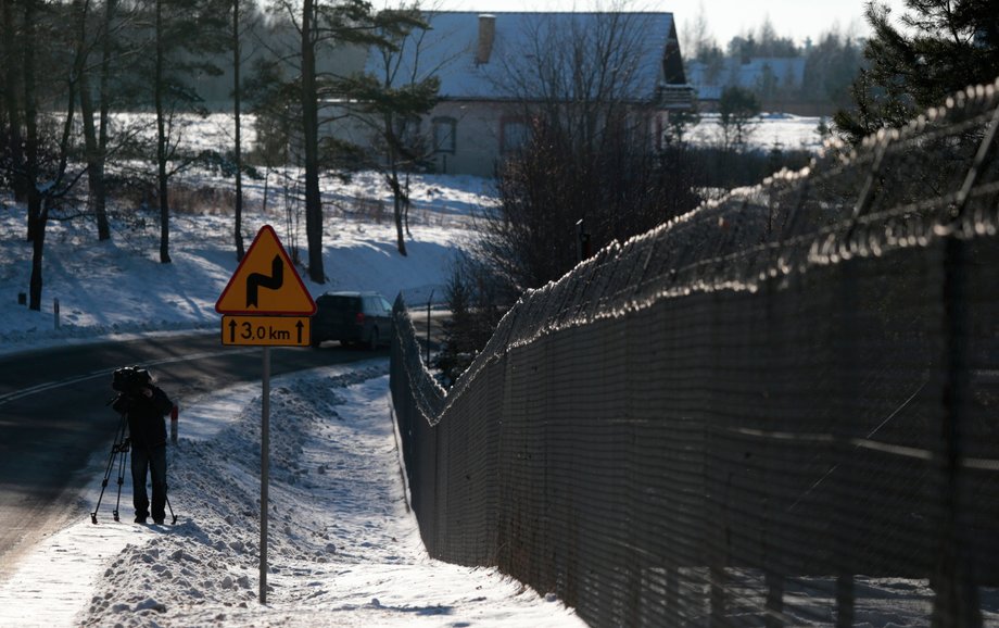 A cameraman films a military area in Stare Kiejkuty village, close to Szczytno in northeastern Poland January 24, 2014. Polish prosecutors were investigating allegations that the CIA ran a secret jail in a Polish forest.