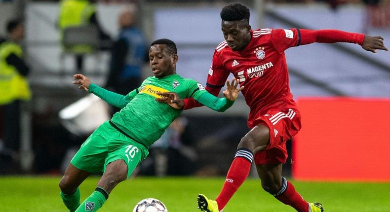 Canadian midfielder Alphonso Davies (R) could make his Bundesliga debut on Friday night after his first appearance for Bayern Munich in Sunday's victory over Borussia Moenchengladbach in the final of a four-team mini tournament in Duesseldorf.