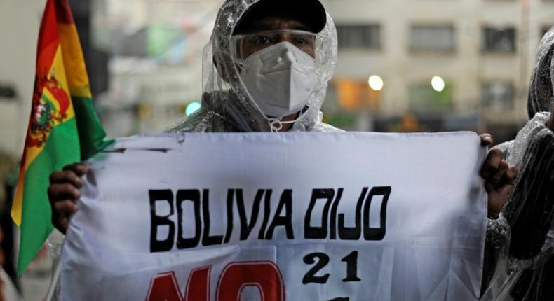 Activists and opponents of Bolivia's former president Evo Morales protest outside Bolivia's Court of Justice in La Paz on September 7, 2020: a judge confirmed that the former president  is not eligible to run for the Senate in the October elections