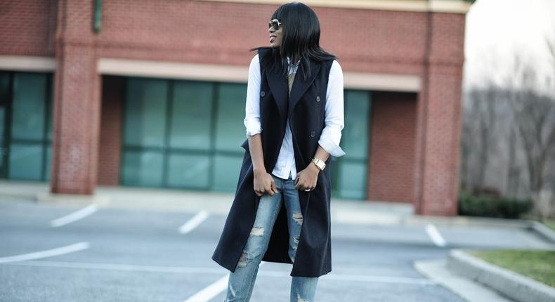 Blogger Stella of Jadore Fashion pulls a chic blazer dress over shirt and boyfriend jeans