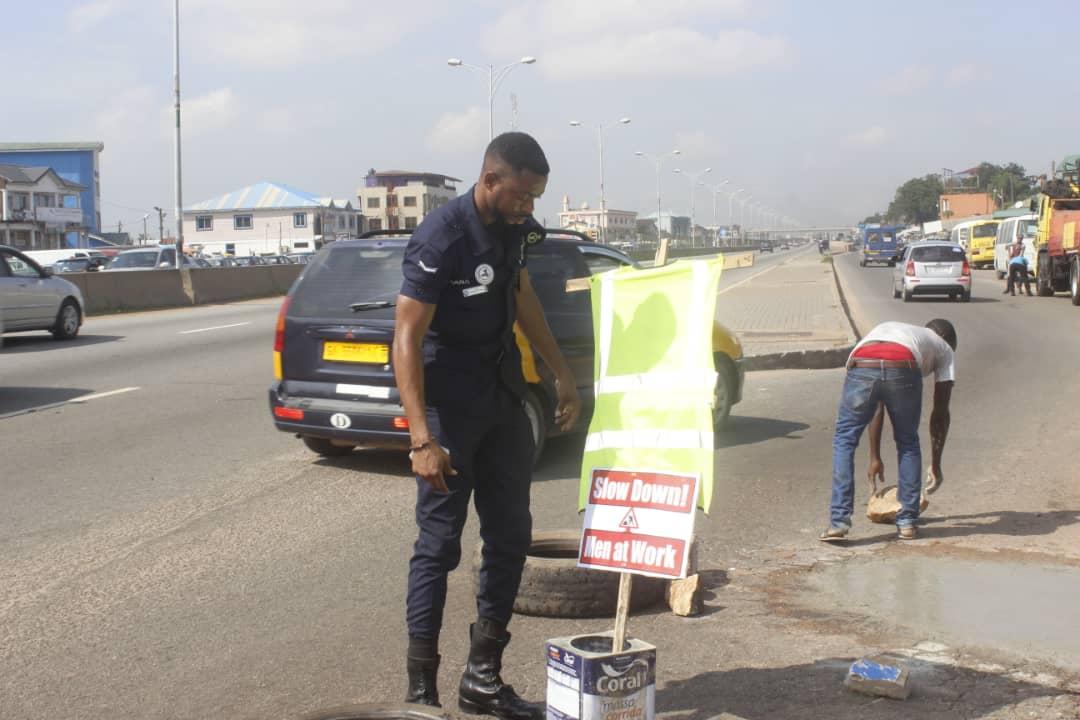 Police officer Lance corporal Agbeko fills deadly potholes in Accra to save lives