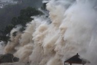 Waves brought by Typhoon Maria lash the shore in Wenzhou