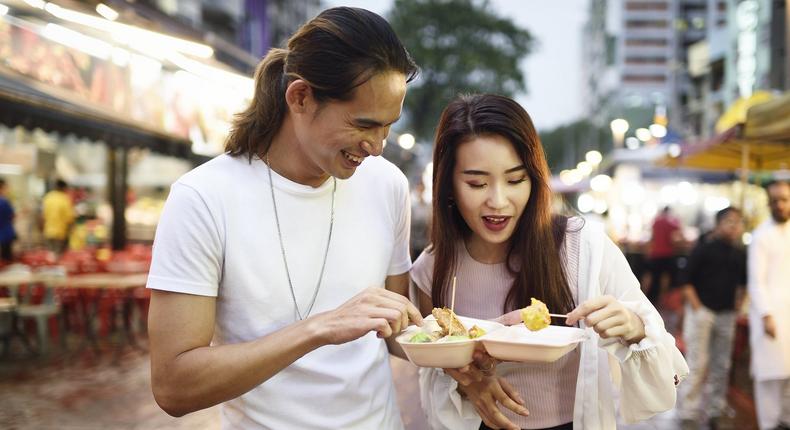 couple eating street food