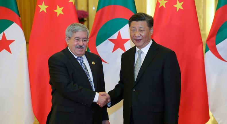 Chinese President Xi Jinping shakes hands with then Algerian prime minister Ahmed Ouyahia in Beijing in 2018