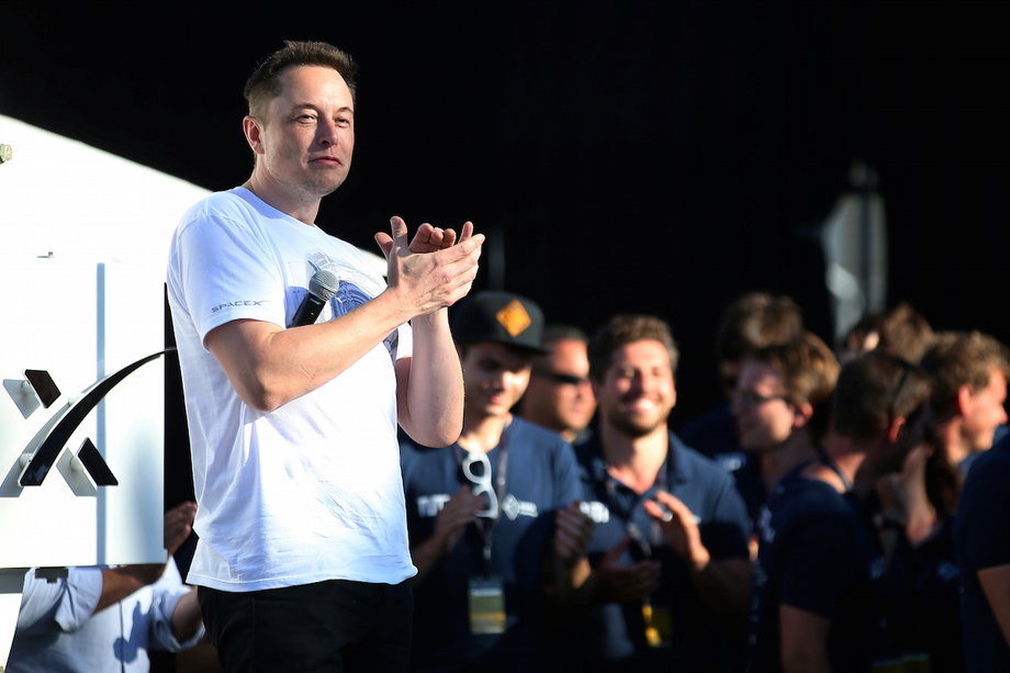 Elon Musk applauds students at SpaceX's Hyperloop competition.