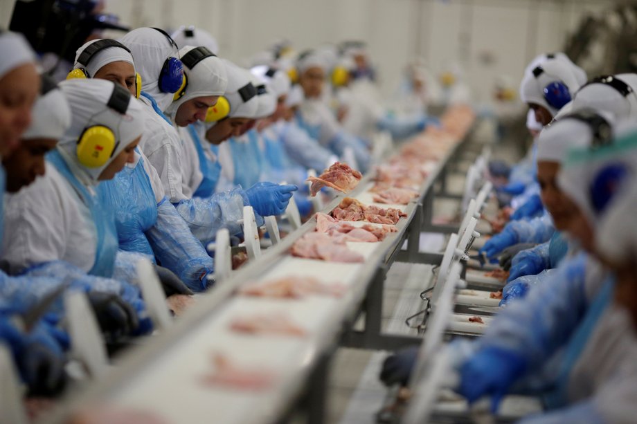 Employees are seen during a technical visit of Brazil's agriculture minister, Blairo Maggi, at the Brazilian meatpacker JBS SA in the city of Lapa, Parana state, Brazil, March 21, 2017.