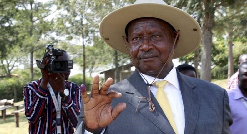 Uganda's incumbent President Yoweri Museveni displays his inked finger after casting his vote at a polling station during the presidential elections in Kirihura in western Uganda, February 18, 2016. REUTERS/James Akena