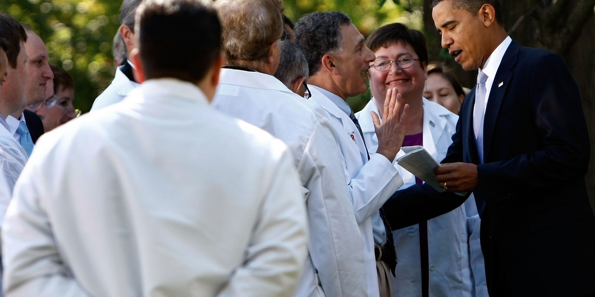 Barack Obama greeting doctors in the Rose Garden following an event at the White House in 2009 in Washington, DC, promoting his healthcare plan.