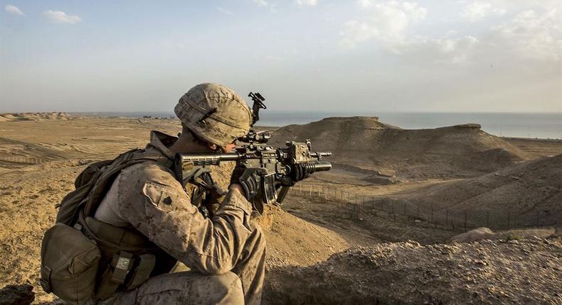 Marine Corps Sgt. Josh Greathouse scans the area during a perimeter patrol in Taqaddum, Iraq, March 21, 2016. Greathouse is a team leader assigned to Bravo Company, 1st Battalion, 7th Marine Regiment, Special Purpose Marine Air Ground Task Force Crisis Response, for US Central Command.