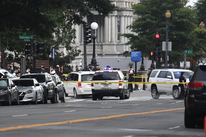 Police officers stop a suspect after a shooting incident outside of the White House, in Washington