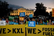 A small group of activists gather to celebrate the Obama administration's rejection of the Keystone 