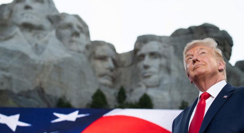Donald Trump in July 2020 at the real Mount Rushmore, which does not feature his face.