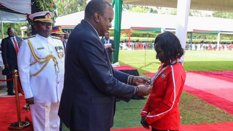 President Uhuru Kenyatta awards decorated athlete Mary Keitany with the OGW title at State House on December 12, 2019