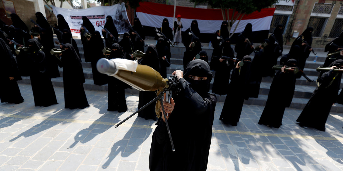 A woman loyal to the Houthi movement holds a rocket-propelled grenade as she takes part in a parade to show support for the movement in Sanaa, Yemen, September 6, 2016.
