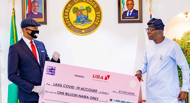 Donation to Lagos 1: UBA Supports Lagos State in Fight Against COVID-19 . Group Managing Director/CEO, United Bank for Africa(UBA), Mr, Kennedy Uzoka presenting a cheque of N1 billion to Governor of Lagos State, Mr. Babajide Sanwo-Olu, as part of the Bank’s donation of over 5 billion Naira (USD14 million), through the UBA Foundation, to catalyse a comprehensive pan-African response to the fight against the coronavirus (COVID-19) global pandemic., in Lagos House, Marina on Sunday. 