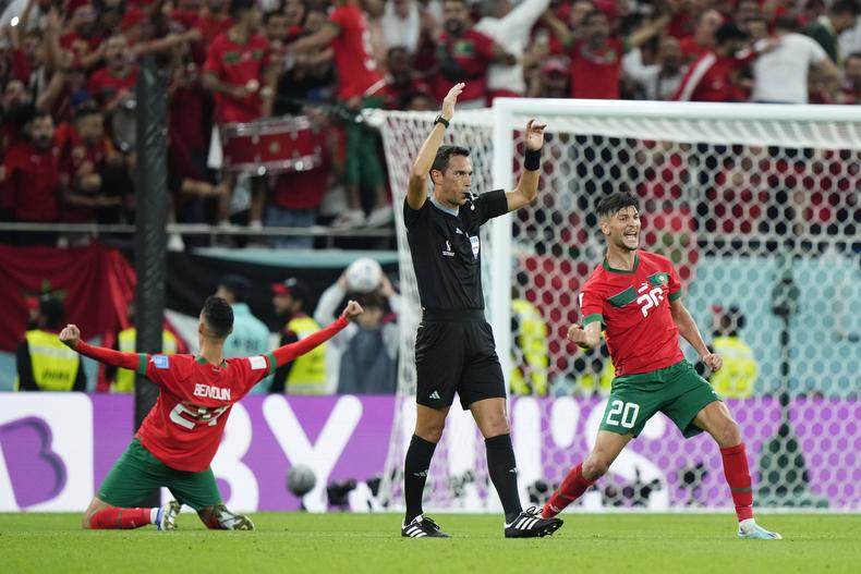Morocco players celebrate after beating Portugal (IMAGO)