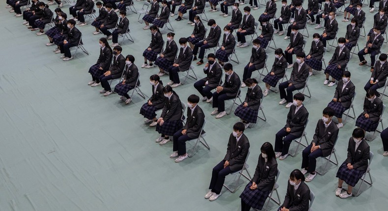 Junior high school students attend the ceremony first day of their new academic year at a school in Japan.Buddhika Weerasinghe/Getty Images)