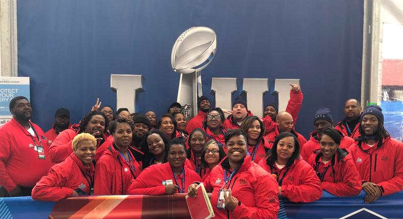 Jamine Moton (center front) with her team of security guards at the 2019 Super Bowl in Atlanta.