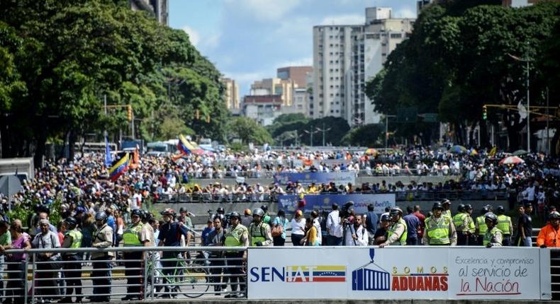 Opponents of Venezuelan President Nicolas Maduro hold a demostration in Caracas on January 23, 2017