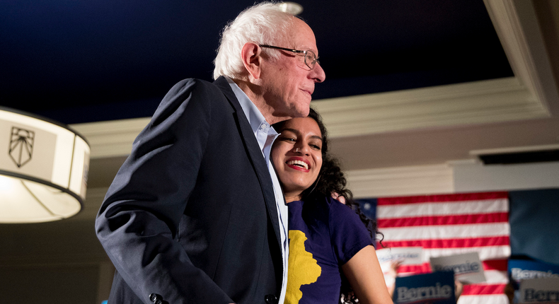 Democratic presidential candidate Sen. Bernie Sanders, I-Vt., left, is welcomed to the stage by Sunrise Movement co-founder Varshini Prakash, right, at a climate rally with the Sunrise Movement at The Graduate Hotel, Sunday, Jan. 12, 2020, in Iowa City, Iowa.