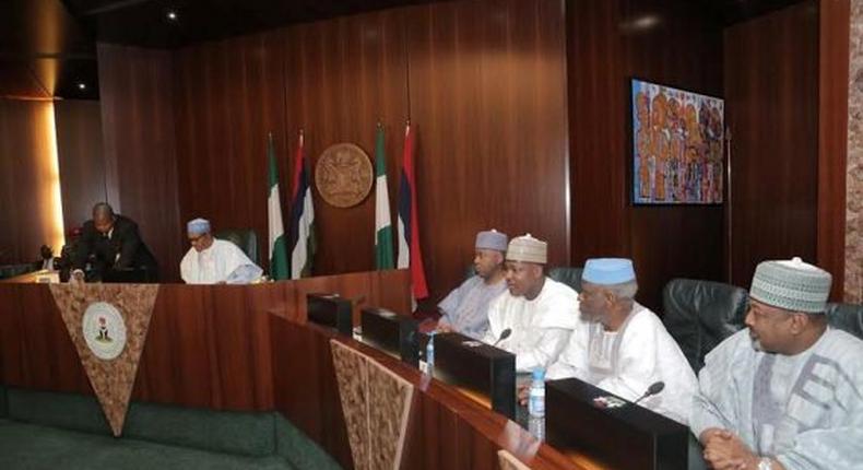 President Muhammadu Buhari swears in new INEC officials in Abuja on November 9, 2015