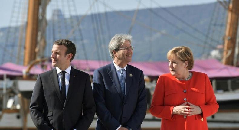 Italy's Prime Minister Paolo Gentiloni (C) met with German Chancellor Angela Merkel (R) and French President Emmanuel Macron (L) in Trieste before an annual Western Balkans summit