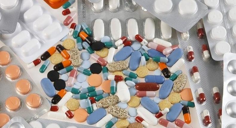 Pharmaceutical tablets and capsules in foil strips are arranged on a table in this picture illustration taken in Ljubljana August 20, 2014.   REUTERS/Srdjan Zivulovic