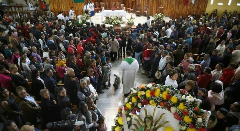 Relatives of three of the people killed in a massive blaze triggered by a leaky pipeline in Tlahuelilpan, Mexico attend their funeral on January 20, 2019