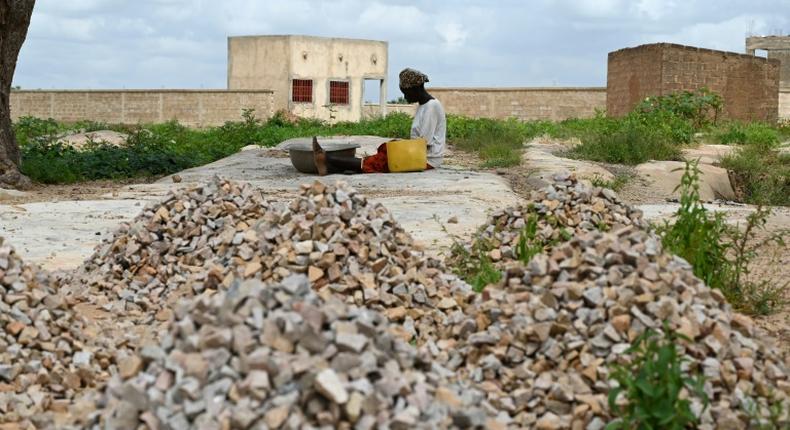 Sixteen people have died in an attack on a mosque in Burkina Faso's volatile north, security sources said; A woman, who is among the 300,000 internally displaced because of jihadist violence in northern and eastern Burkina Faso, is pictured September 17, 2019