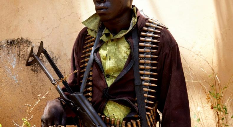 A member of South Sudan's SPLA-IO armed opposition group stands guard during peace talks in Imatong state
