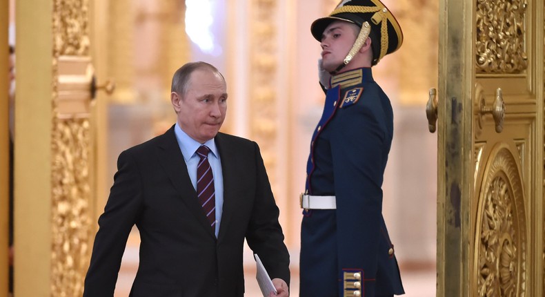 Russian President Vladimir Putin arriving to chair a meeting at the Kremlin in Moscow.