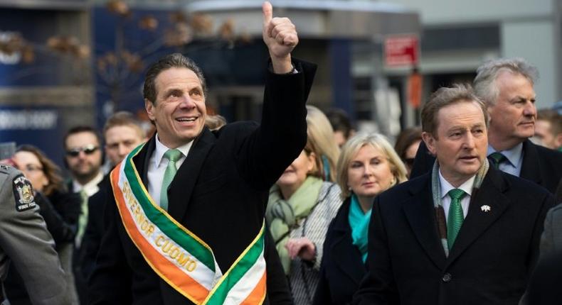 New York Governor Andrew Cuomo (L) said a state immigrant legal defense initiative would ensure the state lived up to the values embodied by the Lady in our Harbor