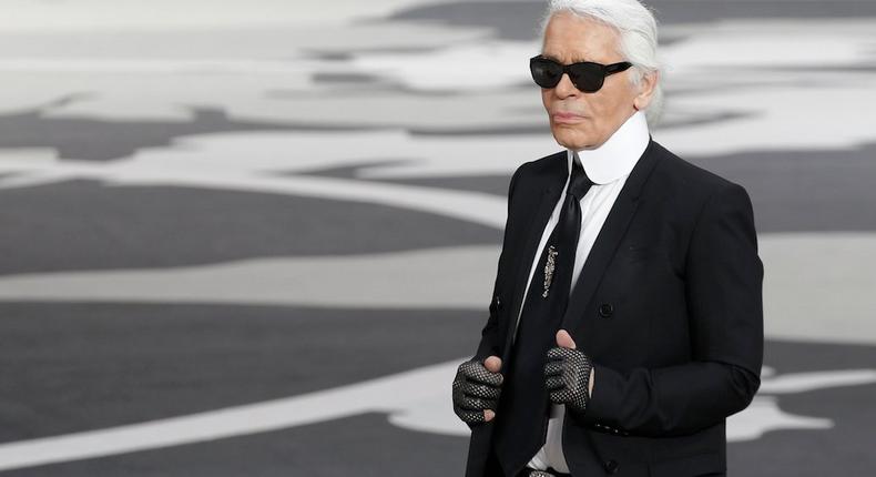 karl lagerfeld with gloves and suit
