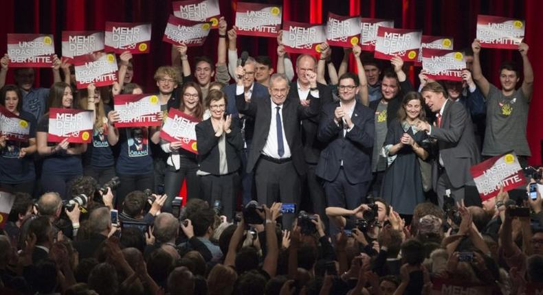 Austrian Presidential candidate Alexander Van der Bellen celebrates with supporters at a post-election event in Vienna on December 4, 2016