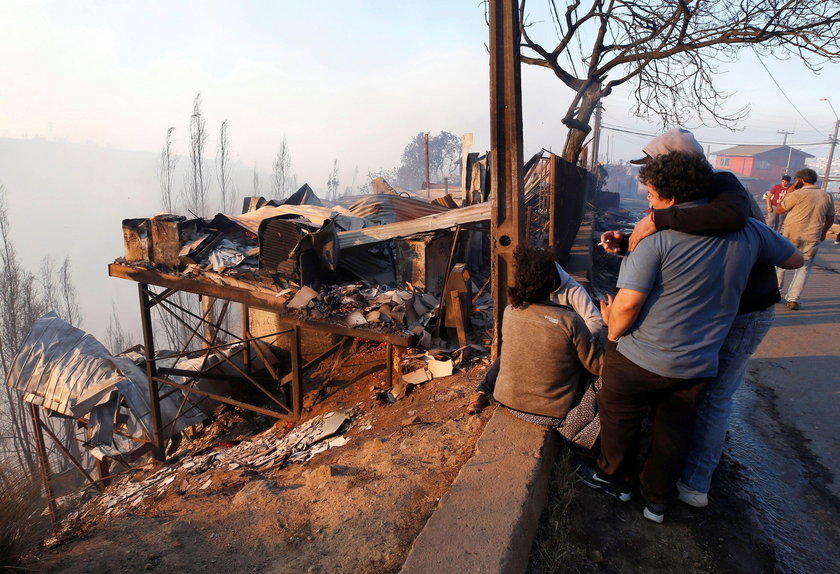 A house burns following the spread of wildfires in Valparaiso