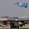 A Ukrainian Su-27 takes off behind a California Air National Guard F-16C at a base in Ukraine in July 2011.US Air National Guard/Tech. Sgt. Charles Vaughn