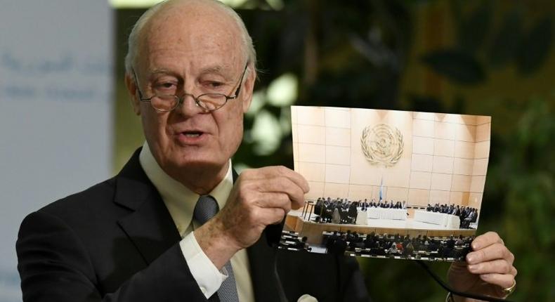 UN Special Envoy of the Secretary-General for Syria Staffan de Mistura shows a picture during a press conference as part of the Intra-Syrian peace talks at the European headquarters of the United Nations in Geneva, on March 3, 2017