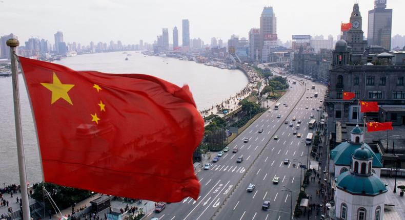 A Chinese flag flying over Shanghai.Liu Liqun/Getty Images