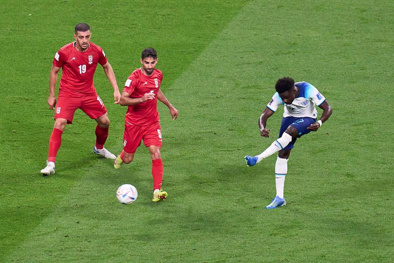 Bukayo Saka (R) of England scores during the Group B match between England and Iran at the 2022 FIFA World Cup on November 21, 2022.