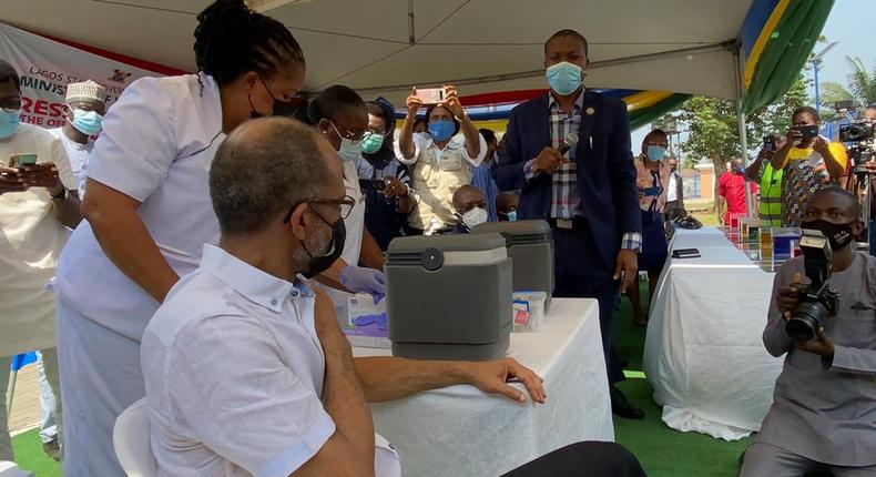 Lagos state Commissioner for Health, Prof Akin Abayomi receiving his first jab of AstraZeneca COVID-19 vaccine. [Twitter/@ProfAkinAbayomi]