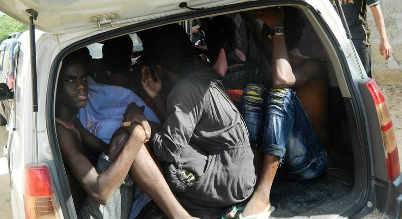 Students of the Garissa University College take shelter in a vehicle after fleeing from an attack by gunmen in Garissa, Kenya, April 2, 2015.