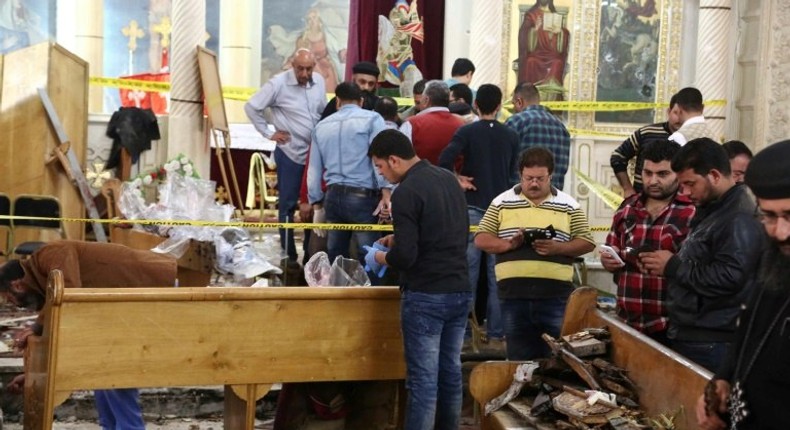 Forensics collecting evidence at the site of a bomb blast which struck worshippers gathering to celebrate Palm Sunday at the Mar Girgis Coptic Church in the Nile Delta City of Tanta, 120 kilometres north of Cairo, on April 9, 2017