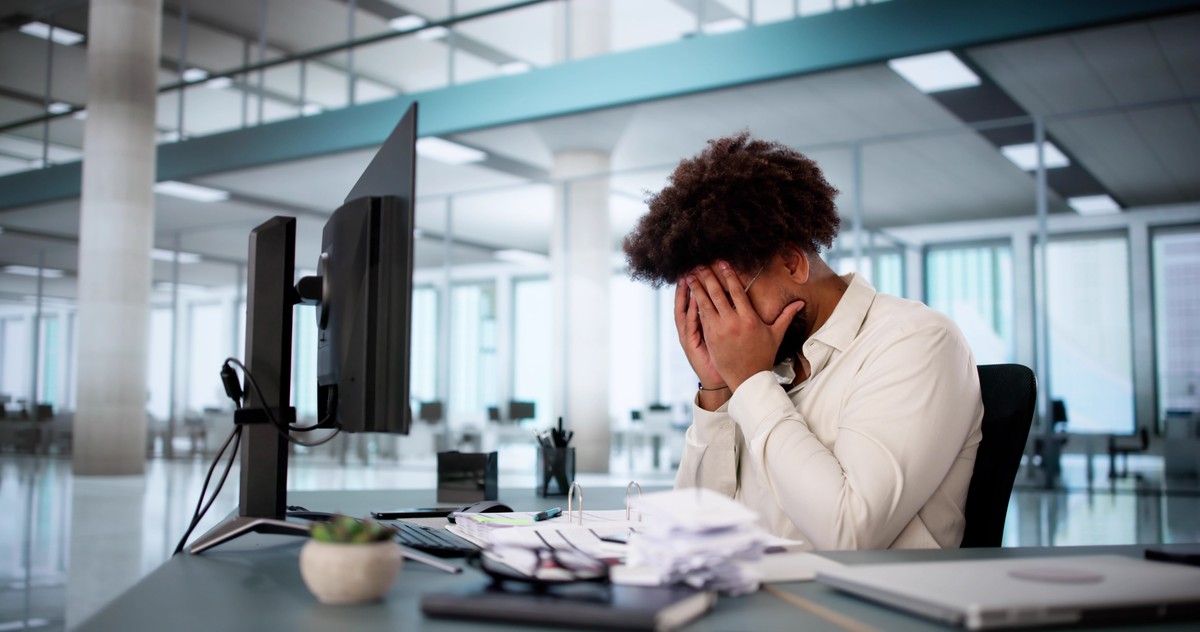 Sad,African,American,Accountant,Feeling,Overwhelmed,At,The,Office,Desk