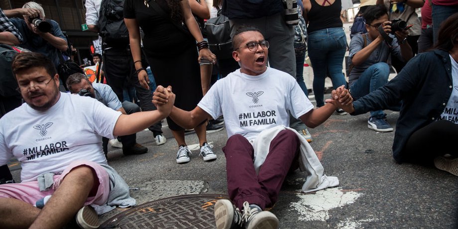 Li Adorno (center) protests near Trump Tower with other immigration activists Tuesday against the Trump administration's decision to end DACA.