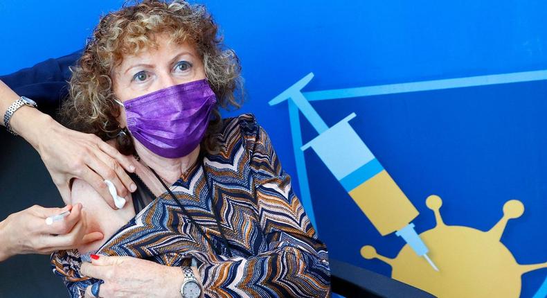 A person receives a fourth dose of the Pfizer-BioNTech COVID-19 vaccine in Tel Aviv on January 3, 2022.