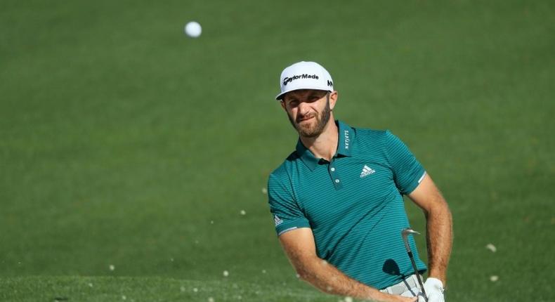 Dustin Johnson of the United States plays a shot from a bunker on the second hole at Augusta National Golf Club