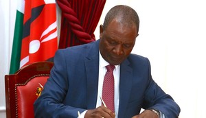 Treasury CS Njuguna Ndung'u signing a Sh400 billion loan with the AfriExim bank at State House on May 2, 2023
